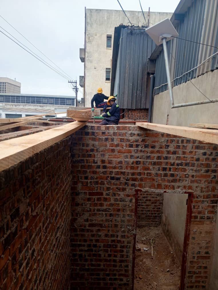 Roof timbers being set onto an unfinished brick shell on a BlickStone site